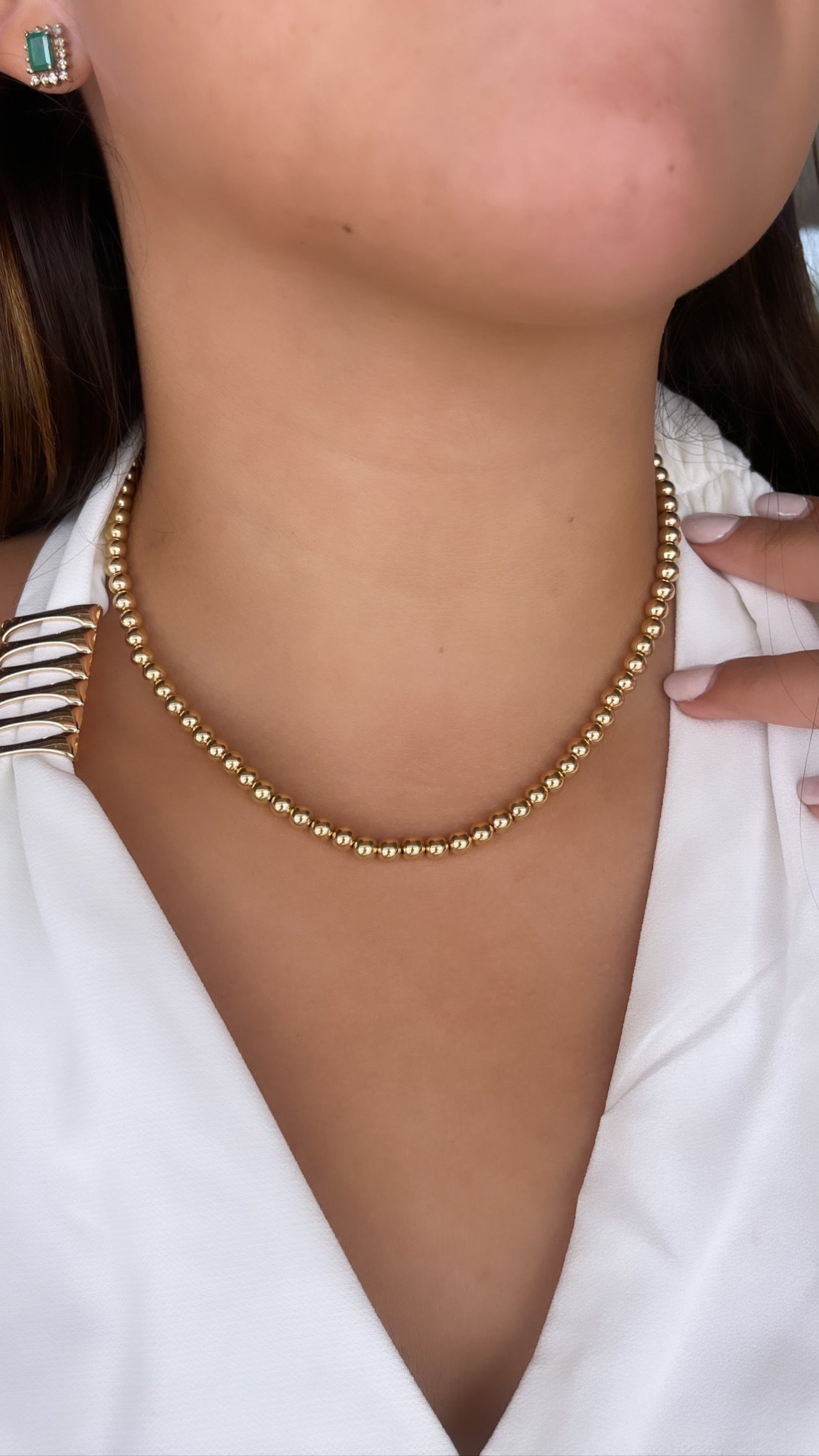 Gargantilla de bolitas en oro amarillo 14k.