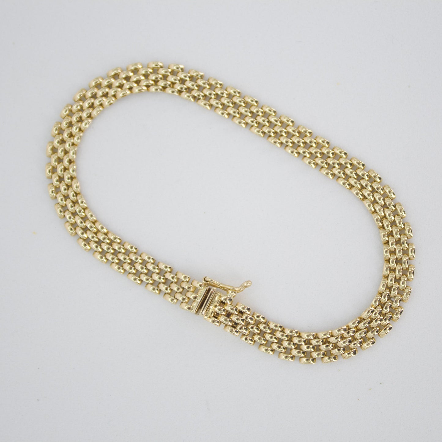 Pulsera tejido pantera en oro amarillo 14k.