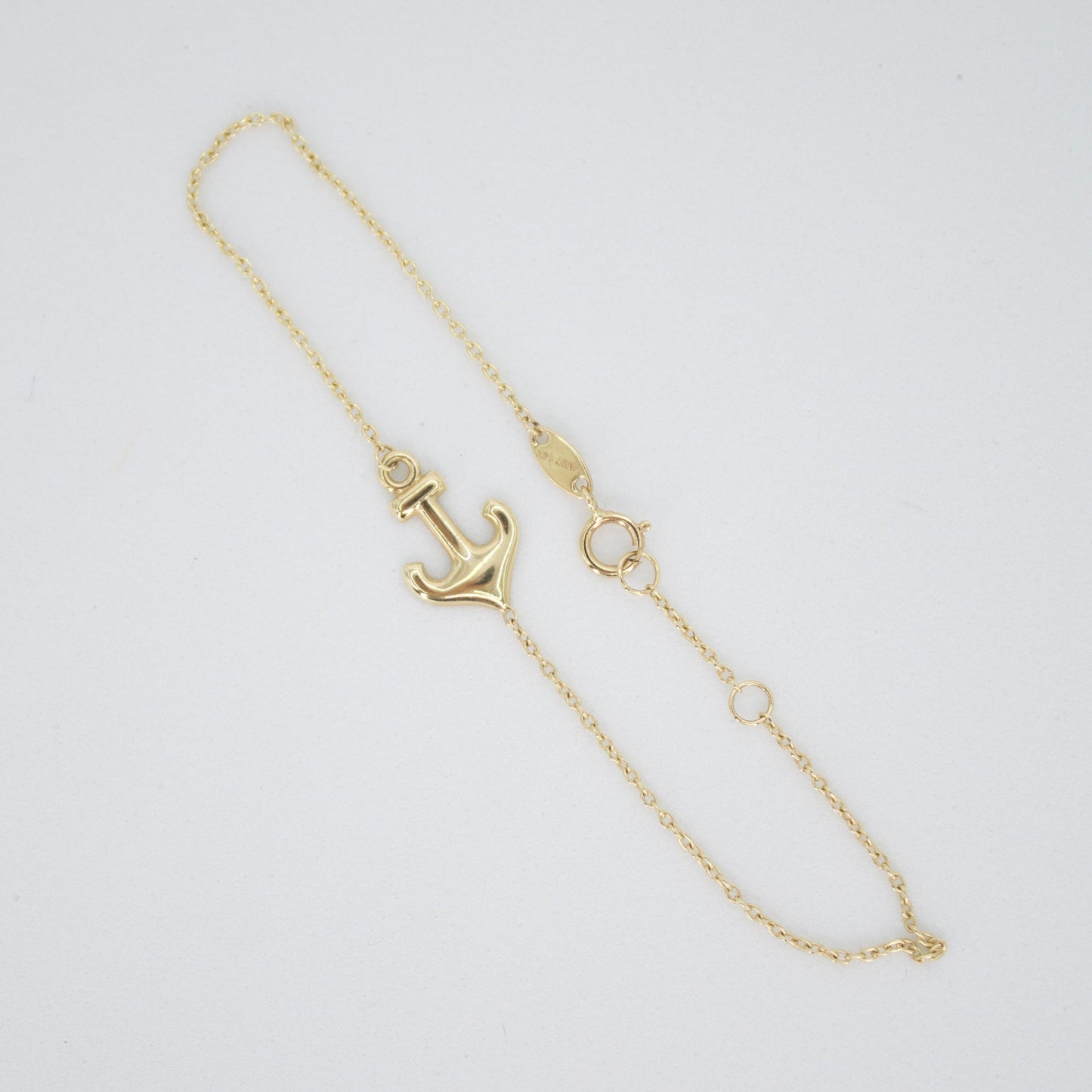 Pulsera con ancla en oro amarillo 14k.