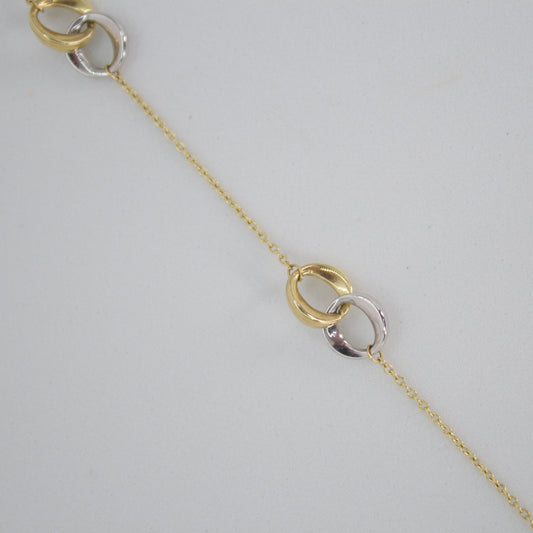 Pulsera doble aro en oro combinado 14k.