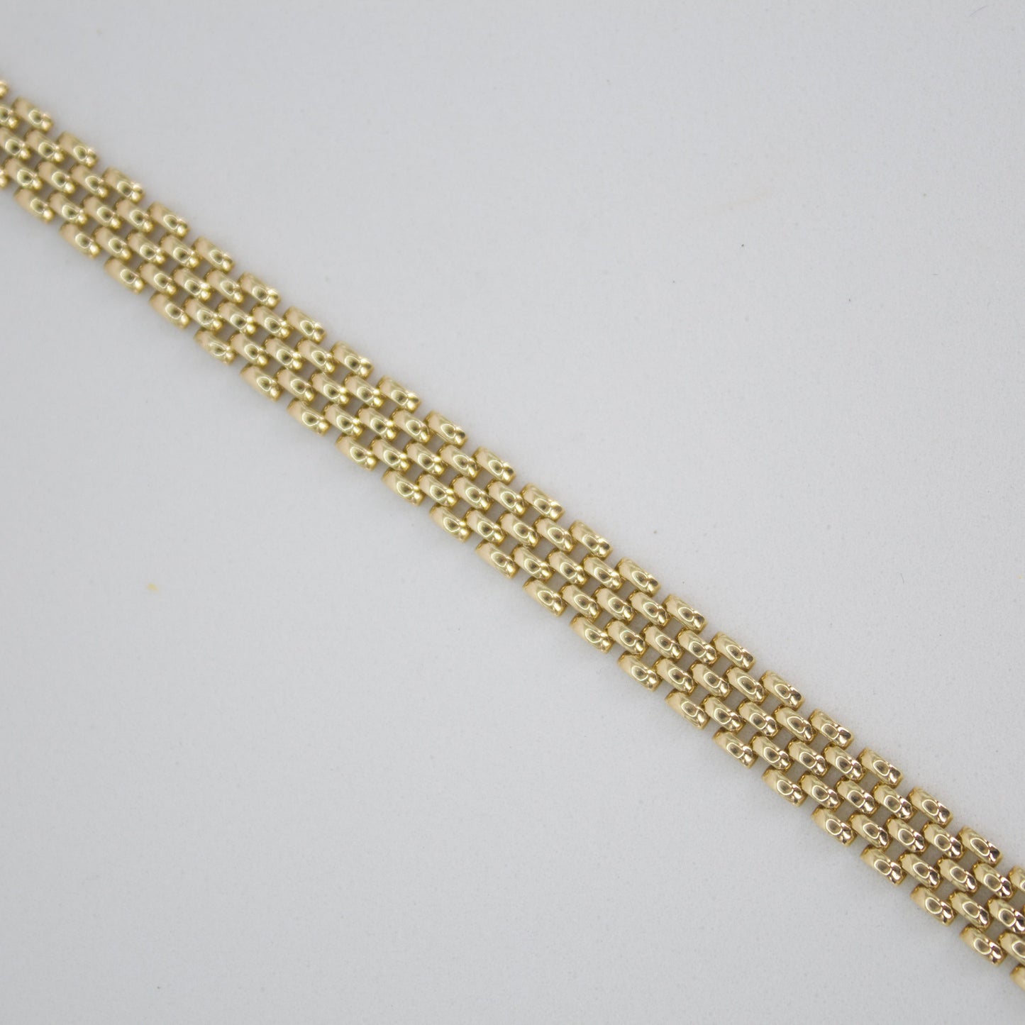 Pulsera tejido pantera en oro amarillo 14k.