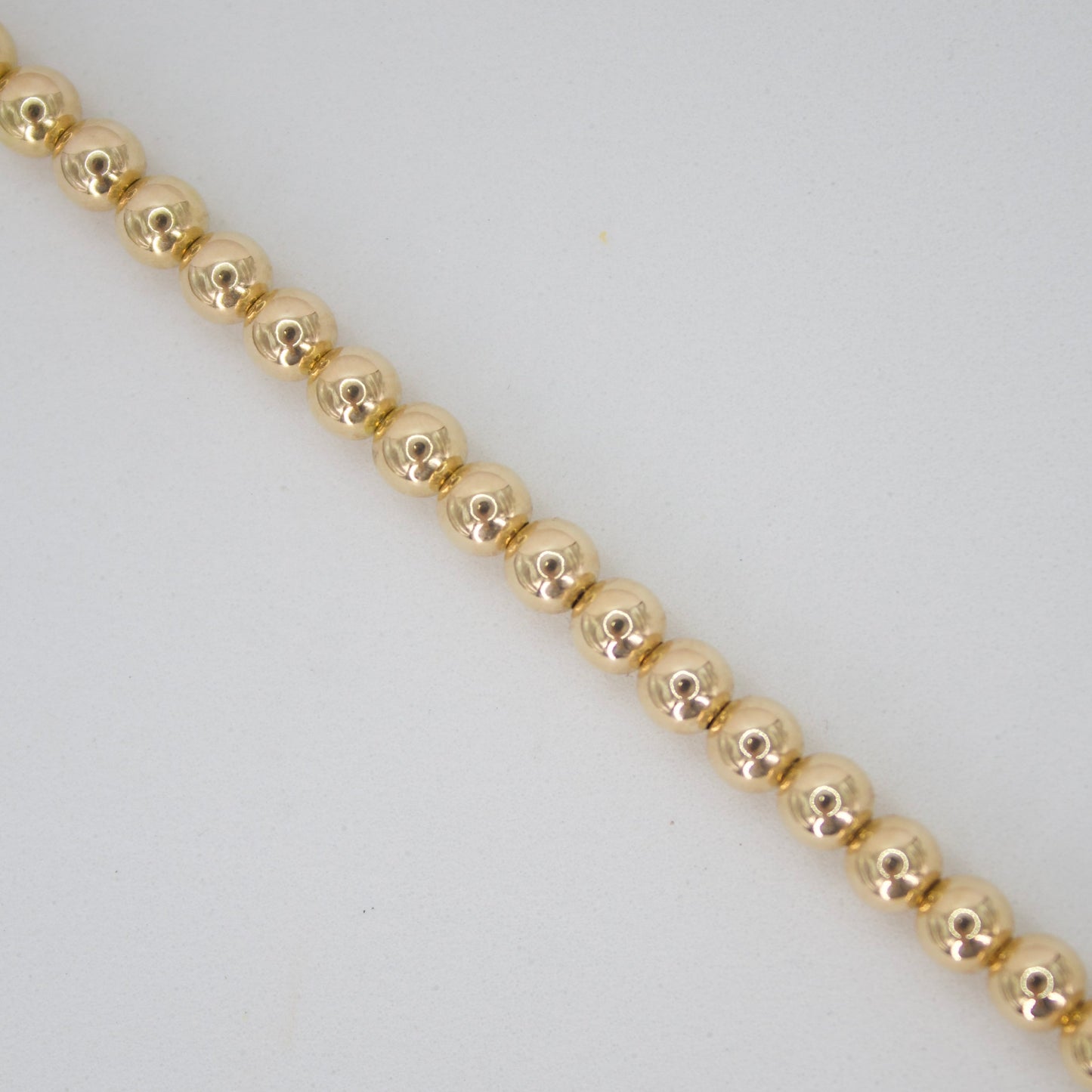 Pulsera de bolitas en oro amarillo 14k.