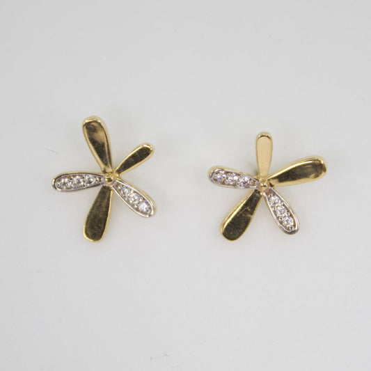 Aretes flor en oro amarillo 14k con zirconias.