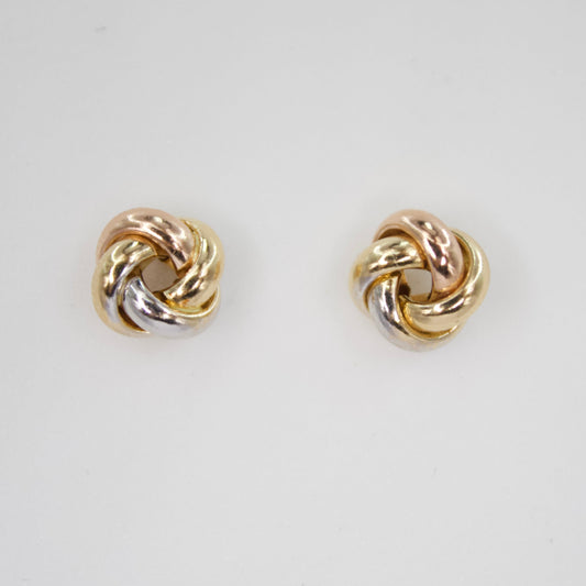 Aretes nudo en oro combinado 14k.